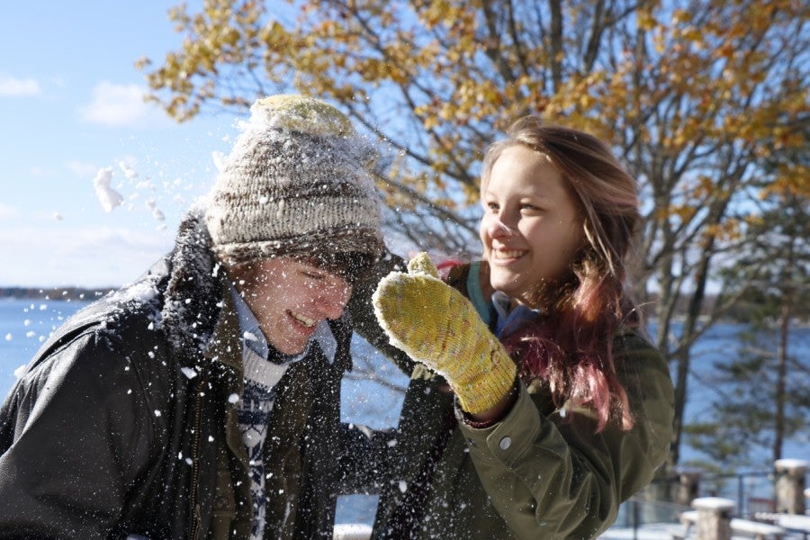 Students play outside in the snow at Interlochen Arts Academy