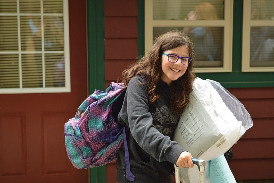 A student arrives for camp