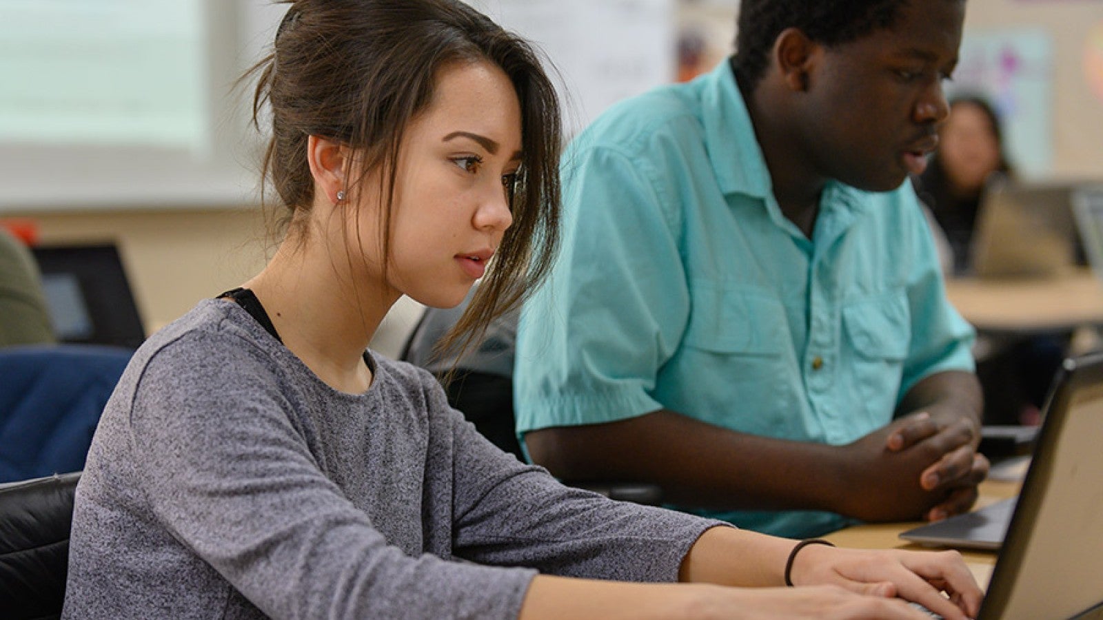 A student works on a laptop