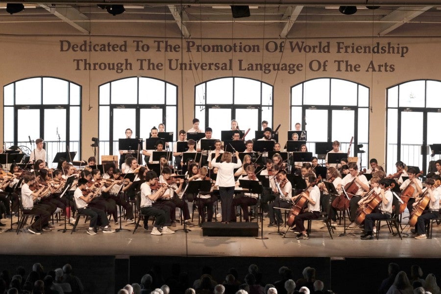 An orchestra performing on stage