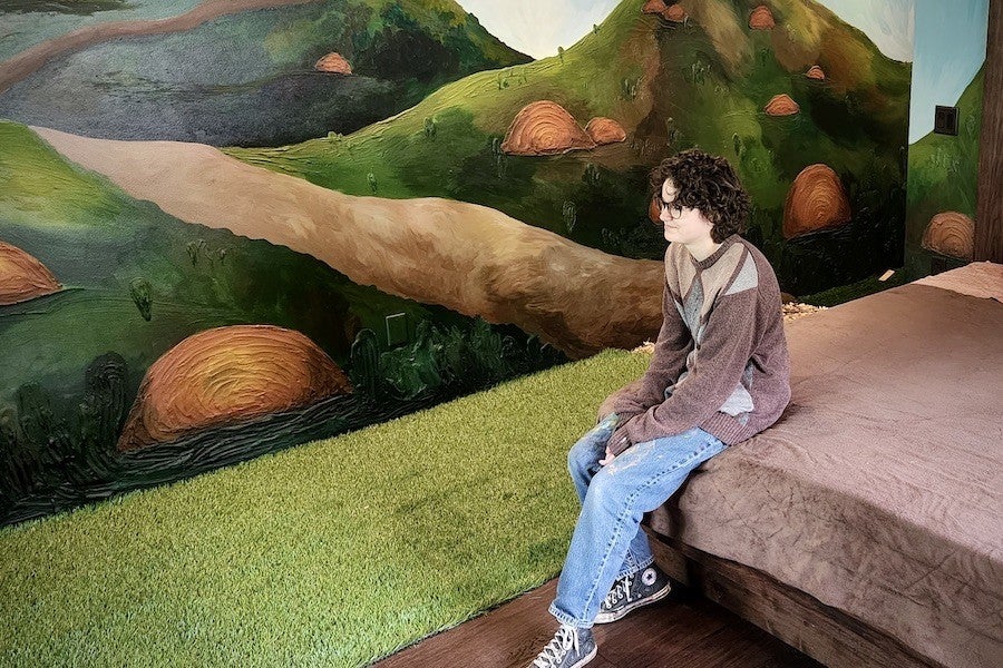 Stone Hotel art room with student artist.