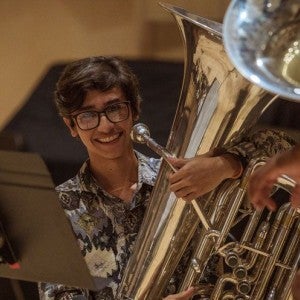 A tubist smiles during a master class with Richard White