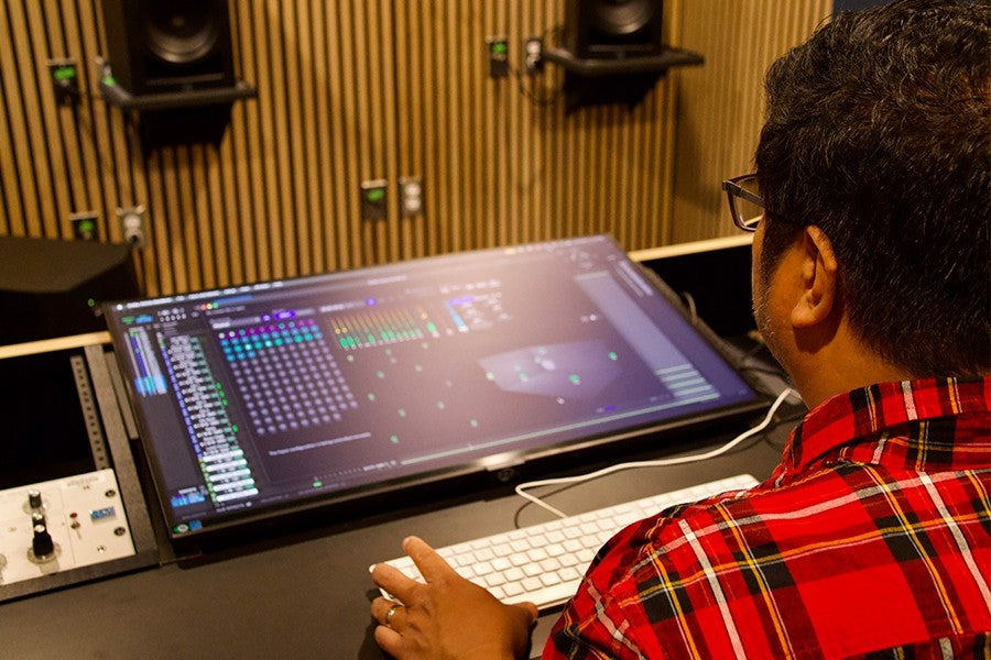 Lacuesta works on a song in the new Atmos room. 