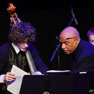 Billy Childs works with an Arts Academy bass student
