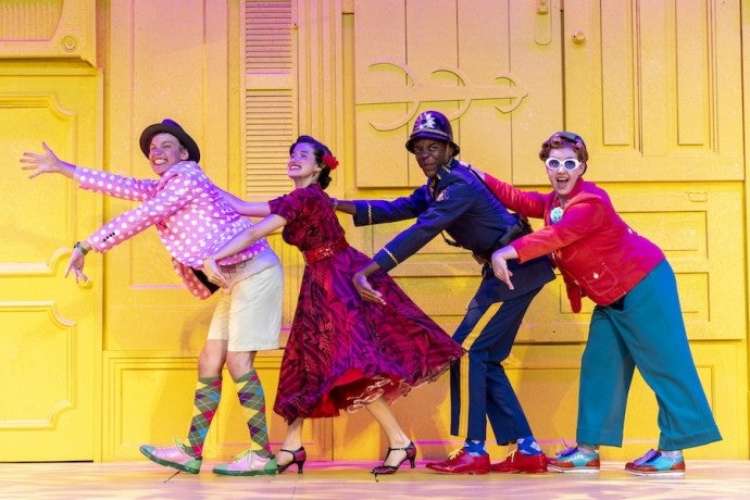 4 people dancing in a line