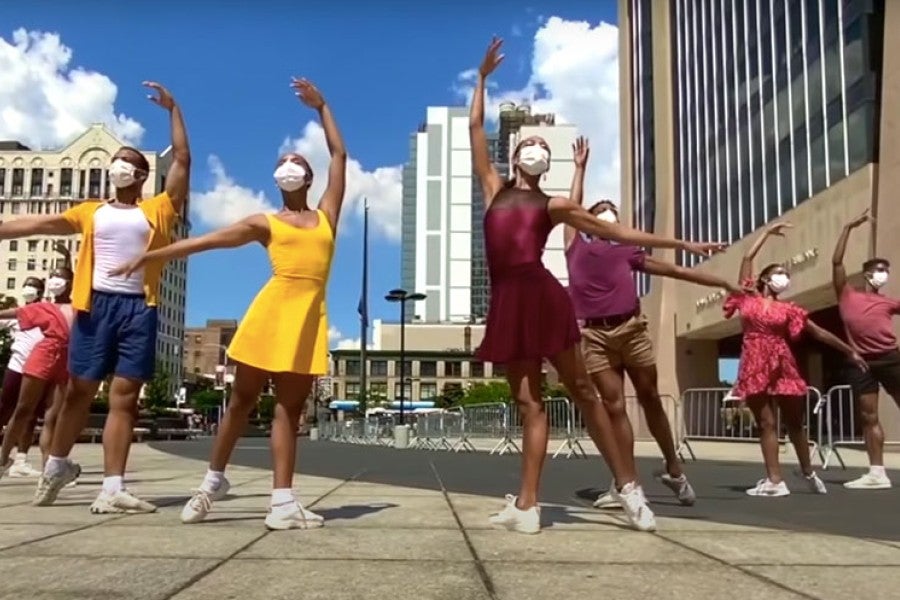 A group of dancers pose in downtown Harlem