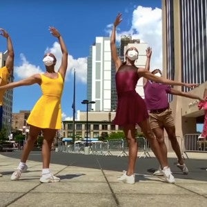 A group of dancers pose in downtown Harlem