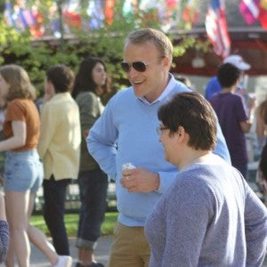 Trey Devey chats with a student during the Street Beat festival.