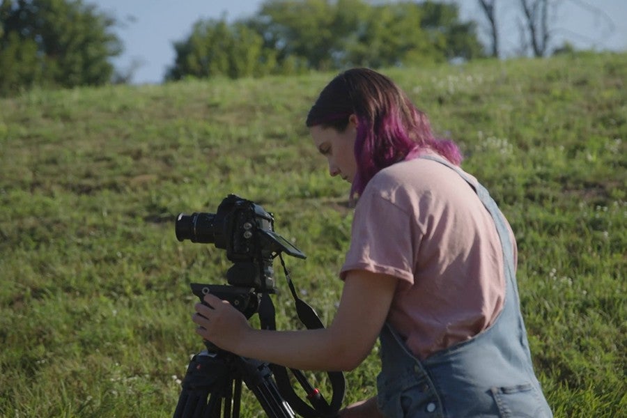 A film student operates a camera at a Grow Benzie event