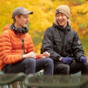 Interlochen Arts Academy students share a conversation on Osterlin Mall