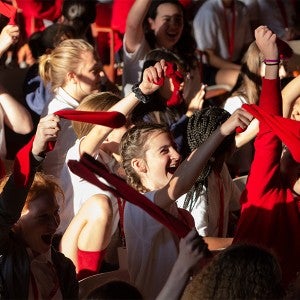 Intermediate students wave socks during First Gathering