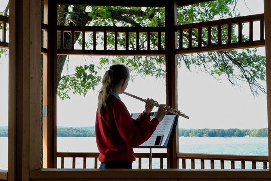 flutist in gazebo at Interlochen Arts Camp