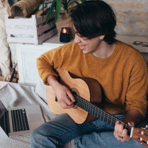 A boy playing guitar