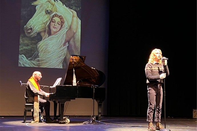 Instructor of Voice Doug Peck accompanies a student performer during the musical cabaret