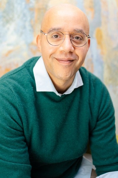 Headshot of Michael Romy Greer