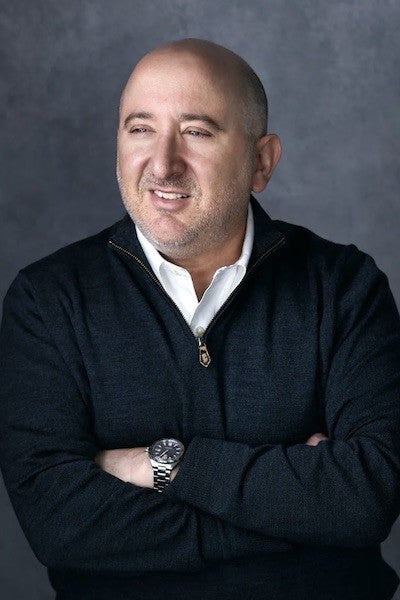 Professional headshot of Adam Glaser