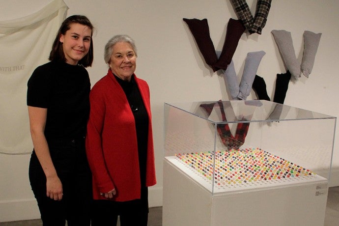 Donor Joanne Sprouse with one of the recipients of the scholarship she created at an event in the Visual Arts gallery.