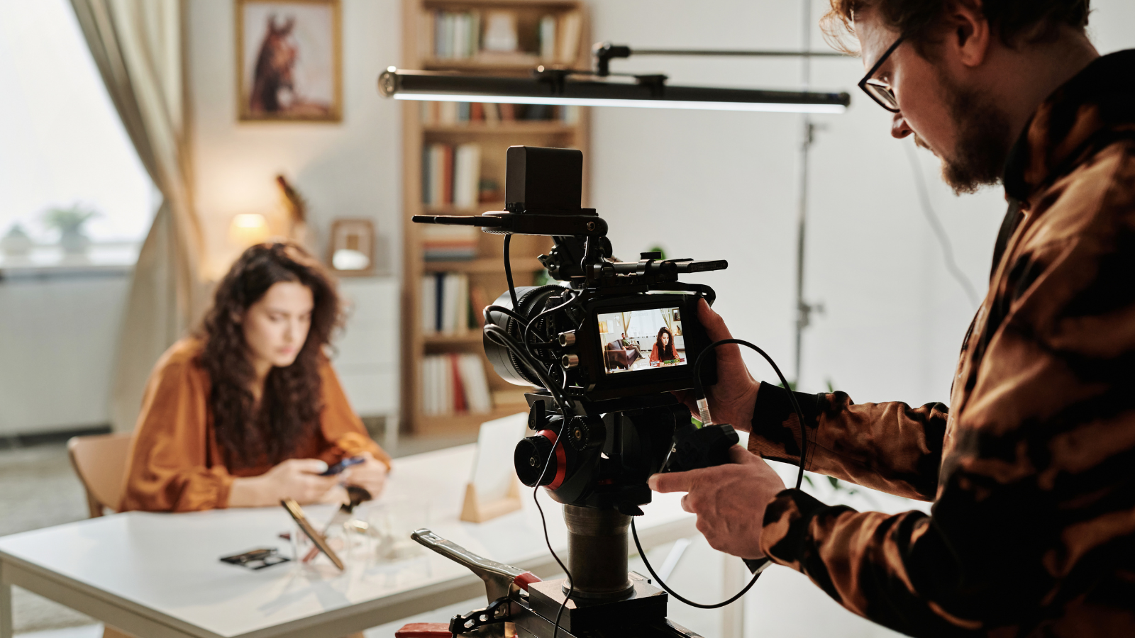 A film set with a camera operator and actress